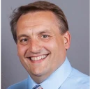 Headshot image of John Neufeld, Executive Director at House of Friendship